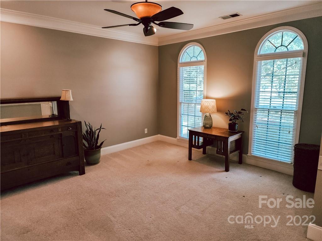 8408 Forest Shadow Circle Cornelius, NC 28031 - Photo 3 of 24 a view of a livingroom with furniture and a window