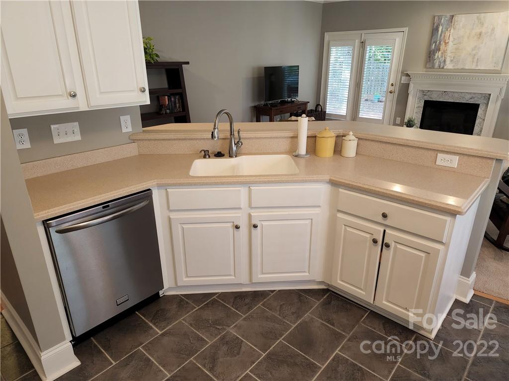 8408 Forest Shadow Circle Cornelius, NC 28031 - Photo 6 of 24 a kitchen with white cabinets and sink