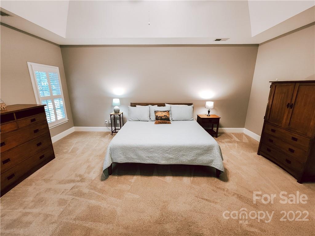 8408 Forest Shadow Circle Cornelius, NC 28031 - Photo 9 of 24 a bedroom with a bed and window