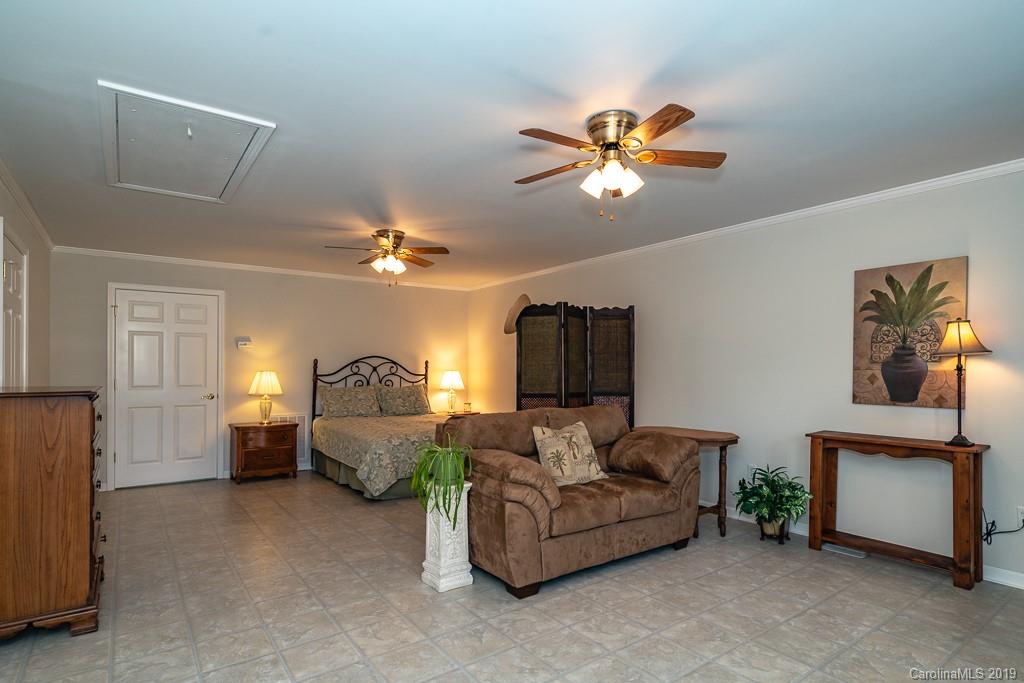 218 West Rambo Road Rock Hill, SC 29730 - Photo 14 of 23 a living room with furniture and a chandelier