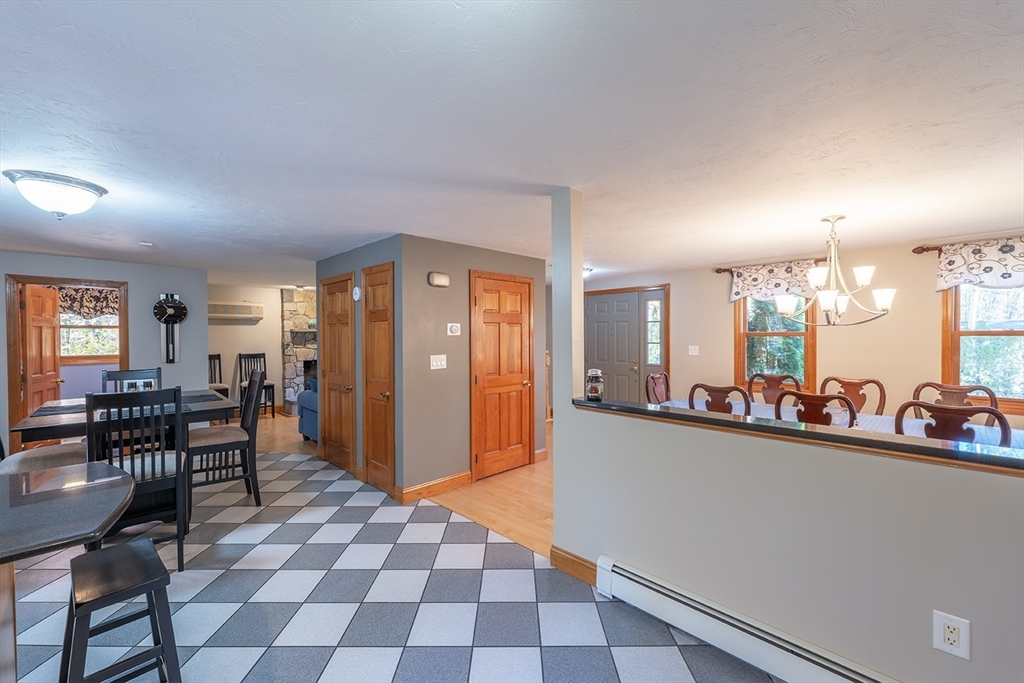46 Long Pond Road Tyngsborough, MA 01879 - Photo 18 of 41 a view of a dining room with furniture and a chandelier