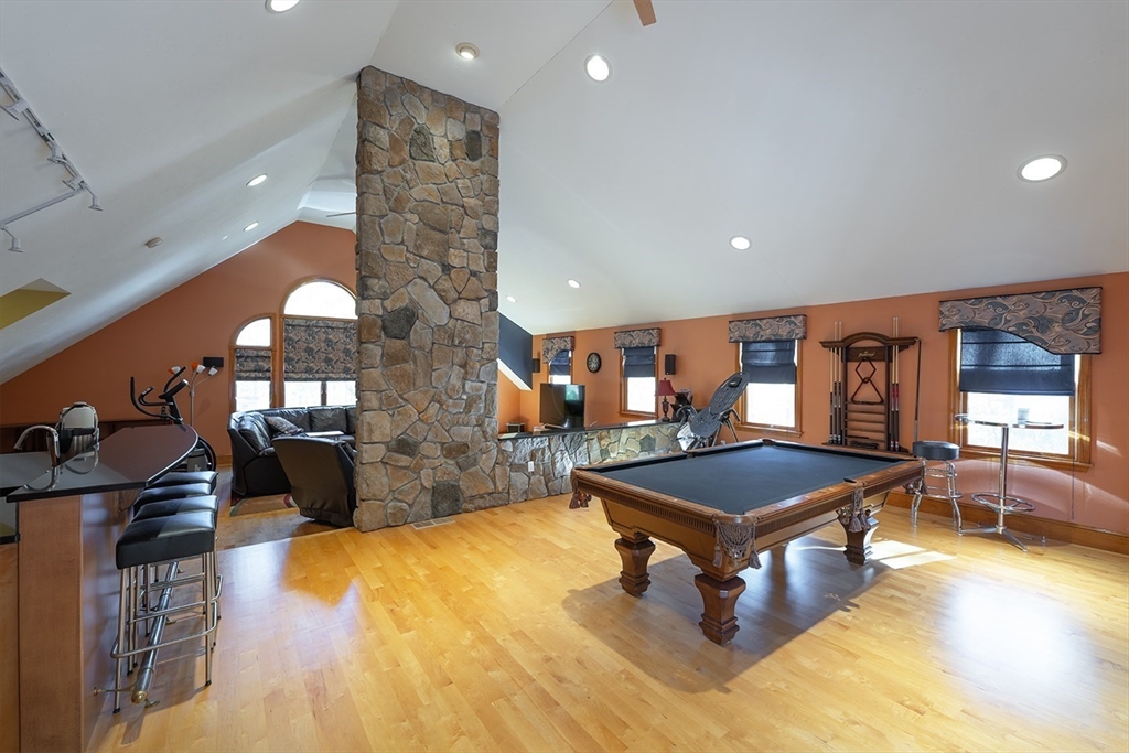 46 Long Pond Road Tyngsborough, MA 01879 - Photo 26 of 41 a living room with furniture pool table and chandelier