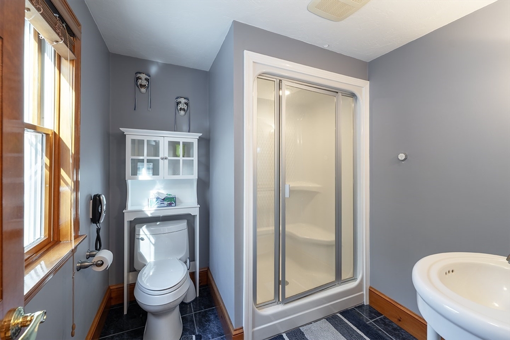 46 Long Pond Road Tyngsborough, MA 01879 - Photo 30 of 41 a bathroom with a toilet a sink and a shower