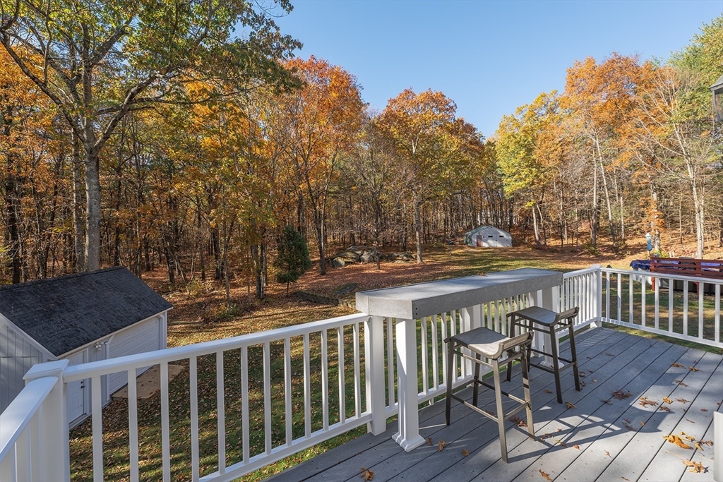 46 Long Pond Road Tyngsborough, MA 01879 - Photo 40 of 41 a view of balcony with wooden floor and outdoor seating