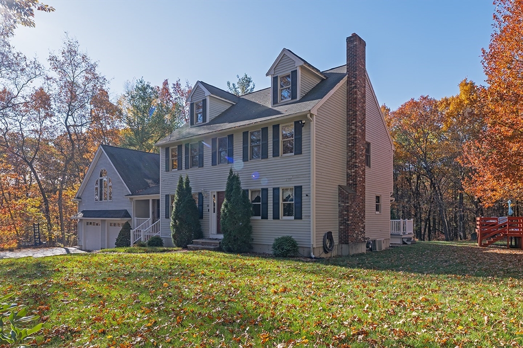 46 Long Pond Road Tyngsborough, MA 01879 - Photo 5 of 41 a front view of a house with a yard