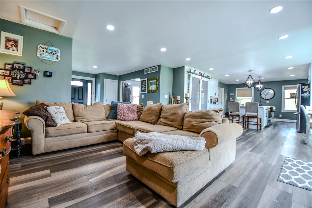 6169 Dayton Farmersville Road Dayton, OH 45417 - Photo 24 of 64 This inviting living space features warm flooring, creating an open and welcoming atmosphere perfect for daily life.