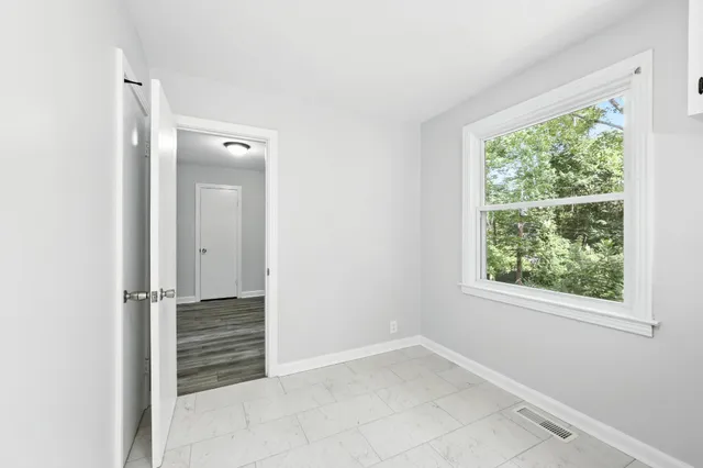 an empty room with windows