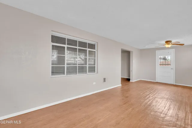 a view of an empty room with a window