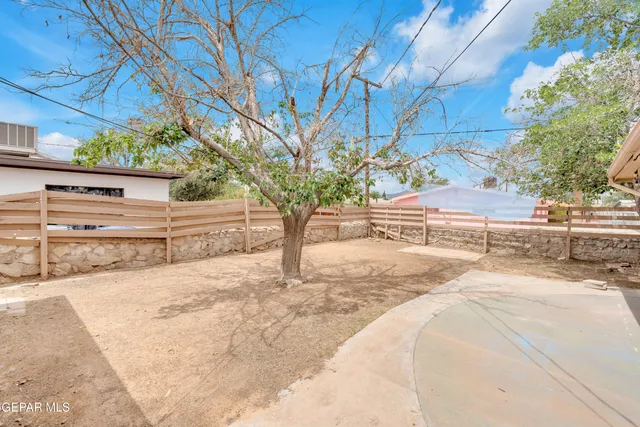 a view of a backyard of the house