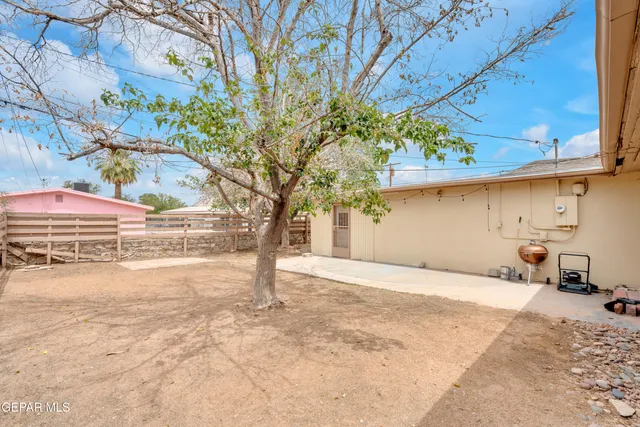 a view of a backyard of a house