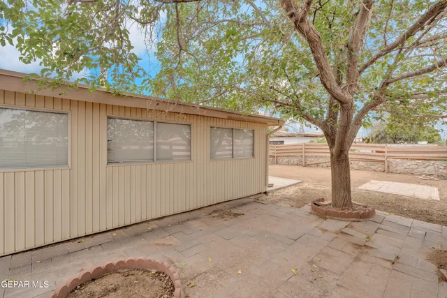a view of a house with a tree