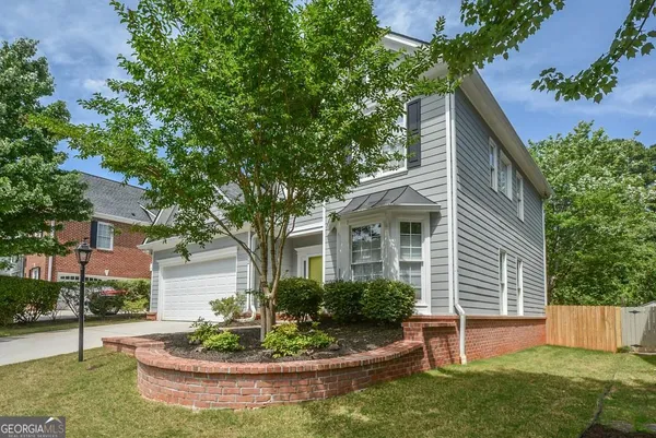 a front view of a house with a yard
