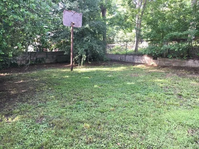 a view of a yard with a tree