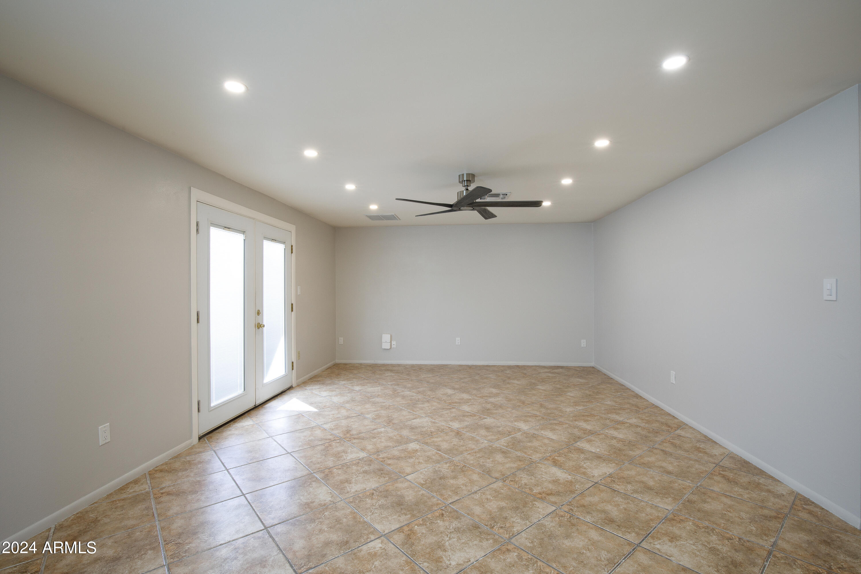 14225 North 39th Way Phoenix, AZ 85032 - Photo 5 of 23 an empty room with a empty space and windows