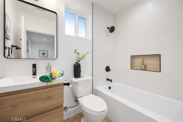 a bathroom with a toilet sink and bathtub