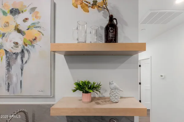 a kitchen with white cabinets stainless steel appliances and a counter space