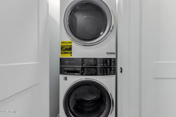 a bedroom with a bed and a tv