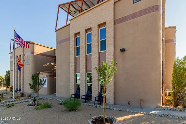 a front view of a building with potted plants