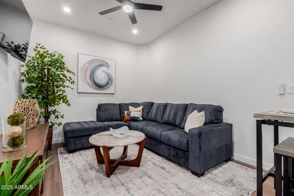 an aerial view of residential houses with outdoor space and parking