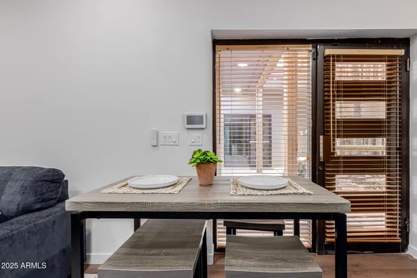 a living room with stainless steel appliances kitchen island granite countertop furniture and a view of kitchen
