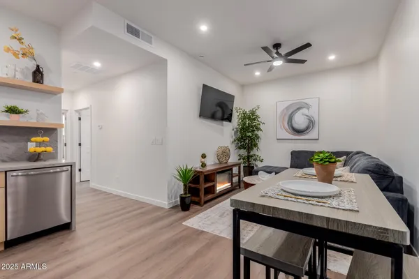 a view of a dining room with furniture and window