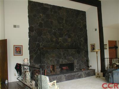5780 Robin Court Santa Maria, CA 93455 - Photo 15 of 15 a living room with furniture a fireplace and a flat screen tv