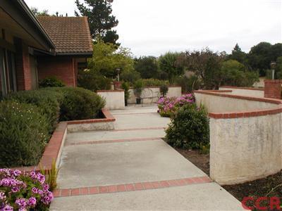 5780 Robin Court Santa Maria, CA 93455 - Photo 2 of 15 a view of a house with a flower garden