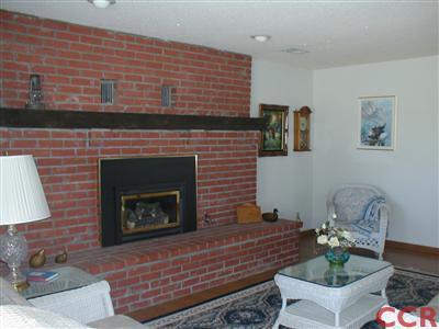 5780 Robin Court Santa Maria, CA 93455 - Photo 8 of 15 a living room with furniture and a fireplace