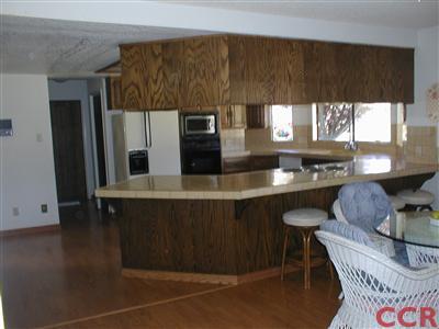 5780 Robin Court Santa Maria, CA 93455 - Photo 10 of 15 a kitchen with stainless steel appliances a sink cabinets and wooden floor