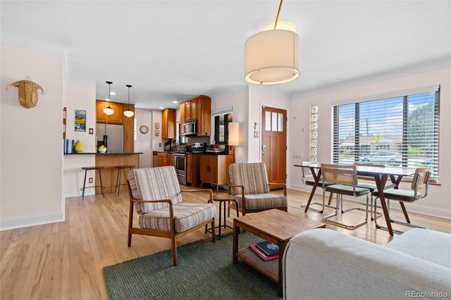 a living room with furniture and a rug