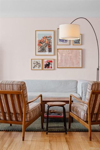 a kitchen with stainless steel appliances kitchen island granite countertop a refrigerator a stove a microwave oven a sink with island and chairs