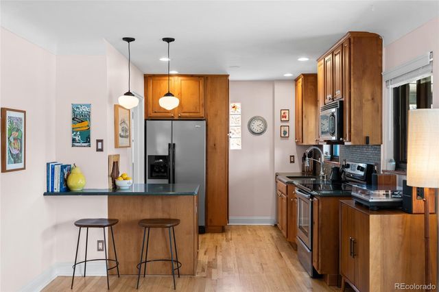 a view of living room with a window and wooden floor