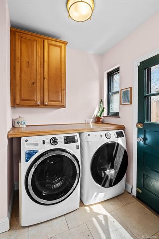 a bedroom with a bed and a wooden floor