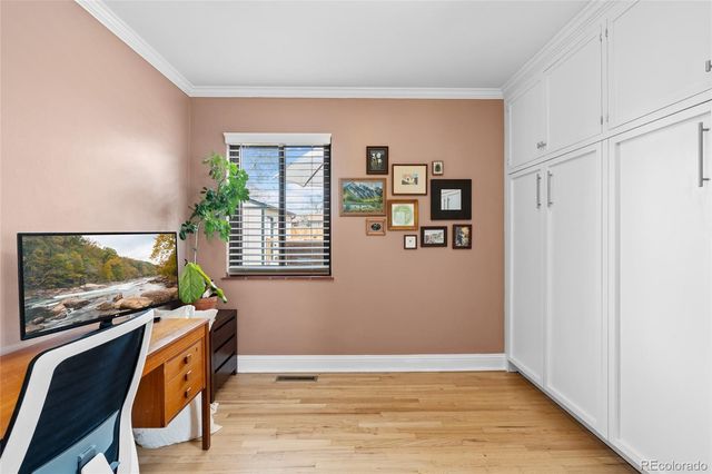 a front view of a house with a yard table and chairs