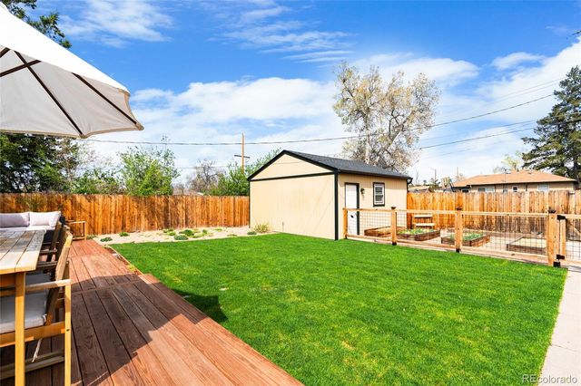 a view of an house with backyard space and garden