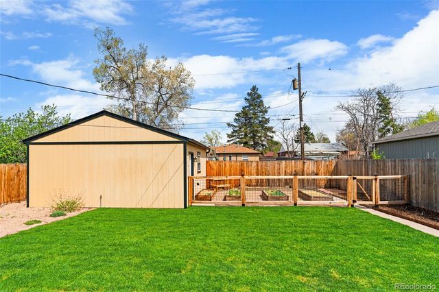 a view of a chair and table in the yard