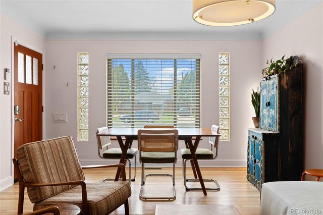 a dining room with furniture and window