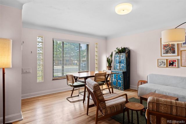 a view of a livingroom with furniture and a potted plant