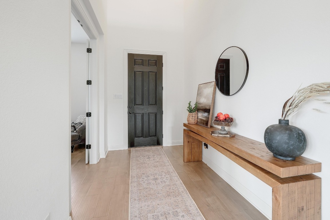 100 Garden Rose Pass Georgetown, TX 78628 - Photo 15 of 39 a kitchen with stainless steel appliances granite countertop a sink and a stove