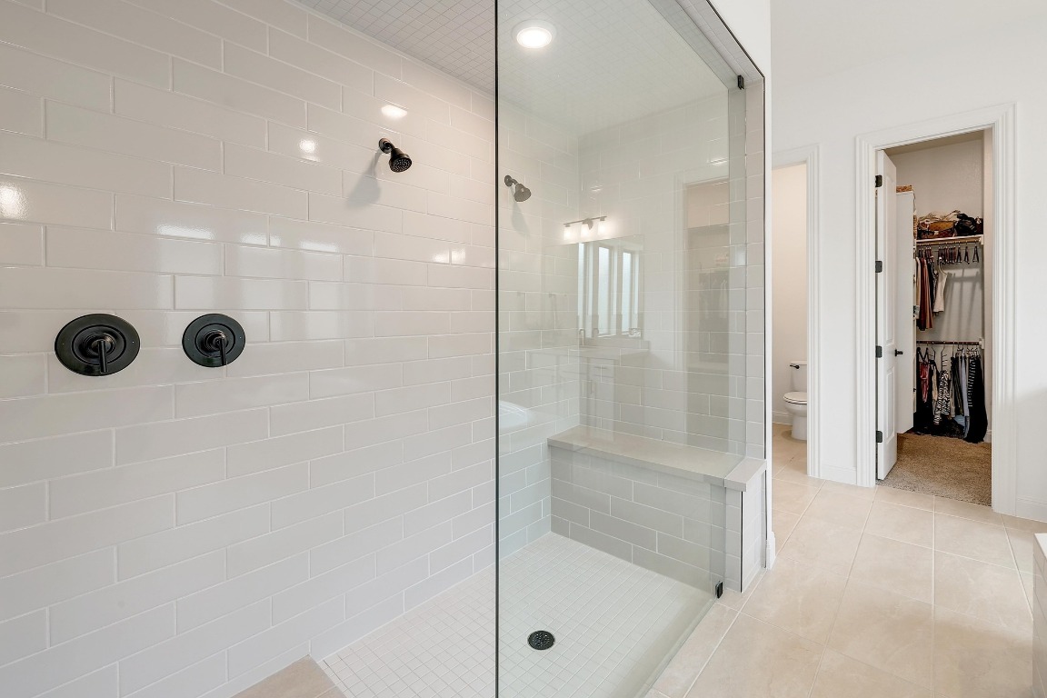 100 Garden Rose Pass Georgetown, TX 78628 - Photo 22 of 39 a bathroom with a glass shower door