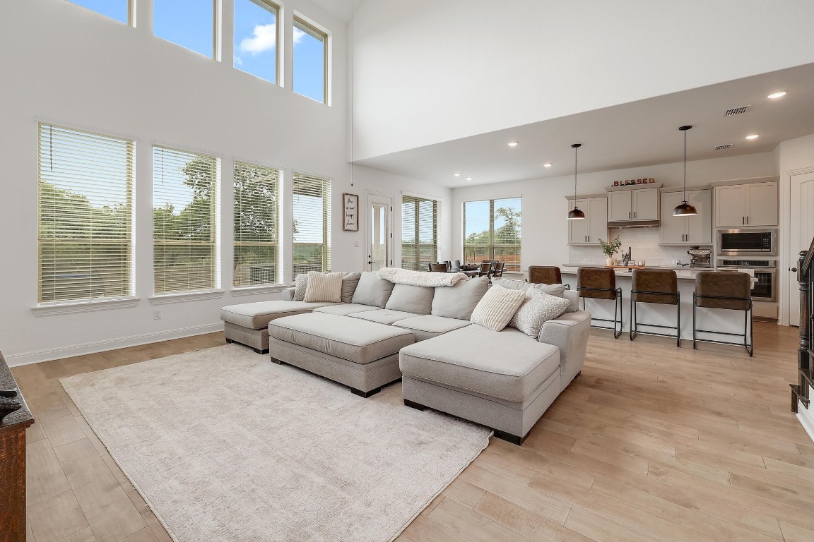 100 Garden Rose Pass Georgetown, TX 78628 - Photo 4 of 39 a living room with furniture and a large window