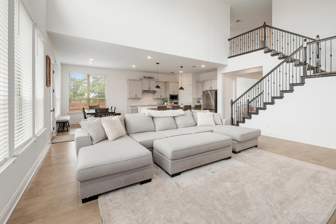 100 Garden Rose Pass Georgetown, TX 78628 - Photo 6 of 39 a living room with furniture or couch and a large window