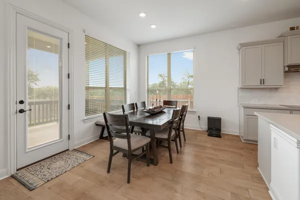 a view of a dining room with furniture window and outside view