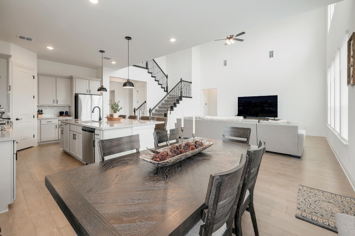 100 Garden Rose Pass Georgetown, TX 78628 - Photo 10 of 39 a living room with stainless steel appliances kitchen island lots of furniture and view kitchen