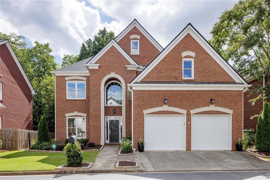 2322 Valley Brook Way Brookhaven, GA 30319 - Photo 1 of 1 a front view of a house with a yard and garage