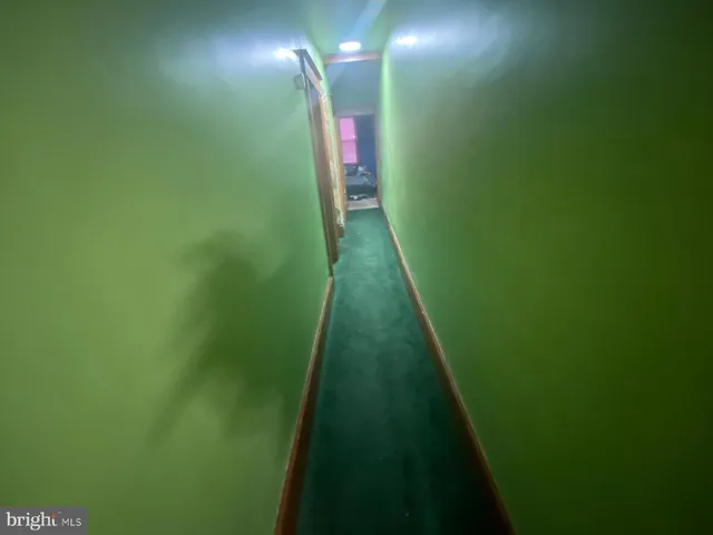 a bedroom with bed and a mirror