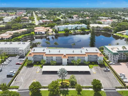an aerial view of a house with a lake view