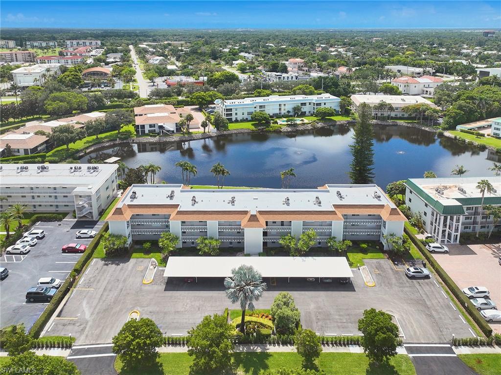 3100 Binnacle Drive, Unit 305 Naples, FL 34103 - Photo 11 of 12 an aerial view of a house with a lake view