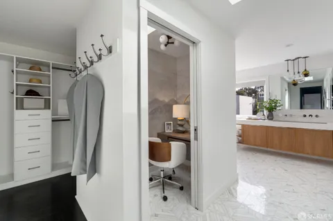 a bathroom with a bathtub and potted plant