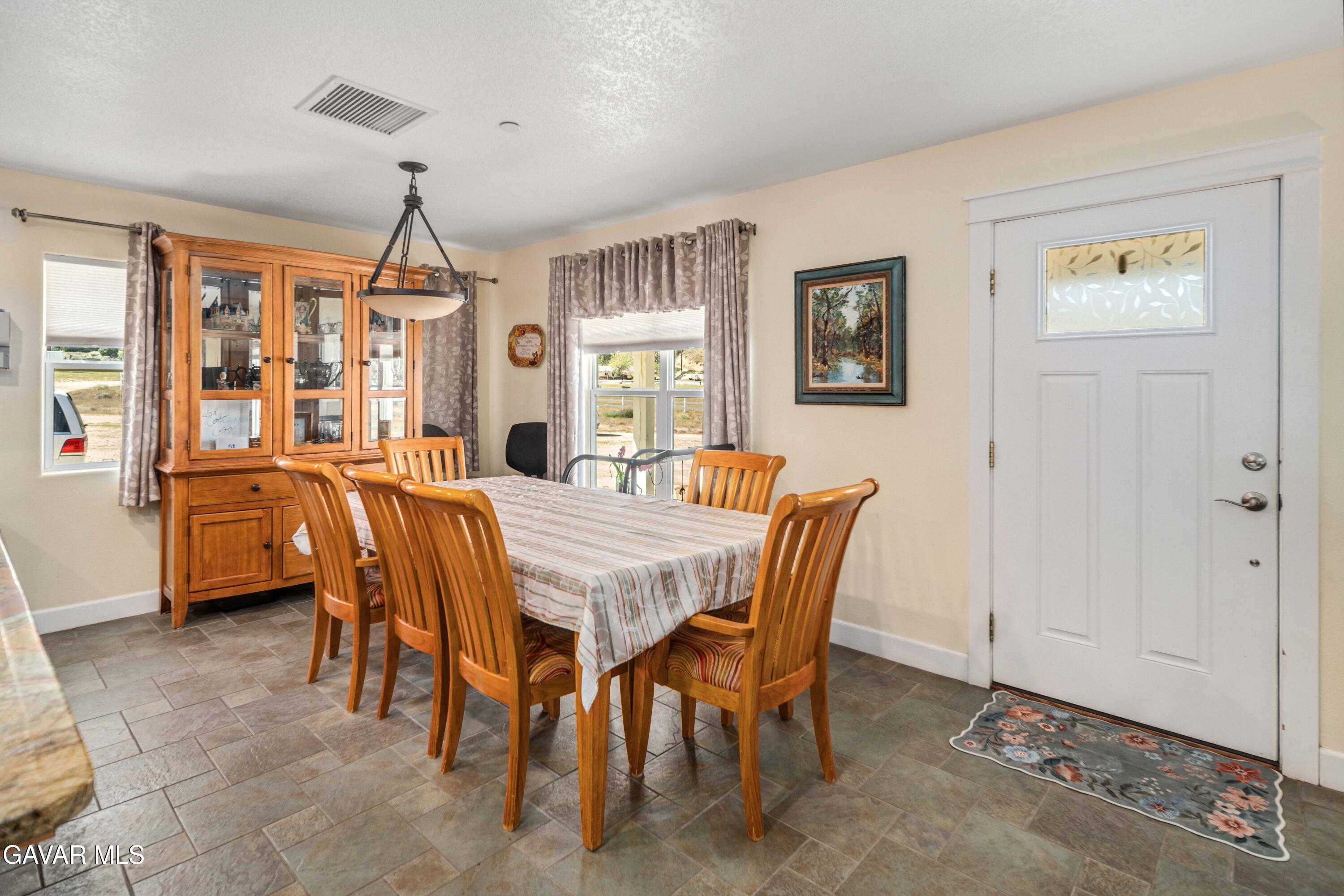 46472 Kings Canyon Road Lancaster, CA 93536 - Photo 15 of 33 a view of a dining room with furniture